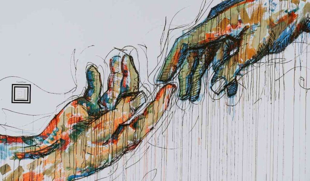 painting of two hands touching each other