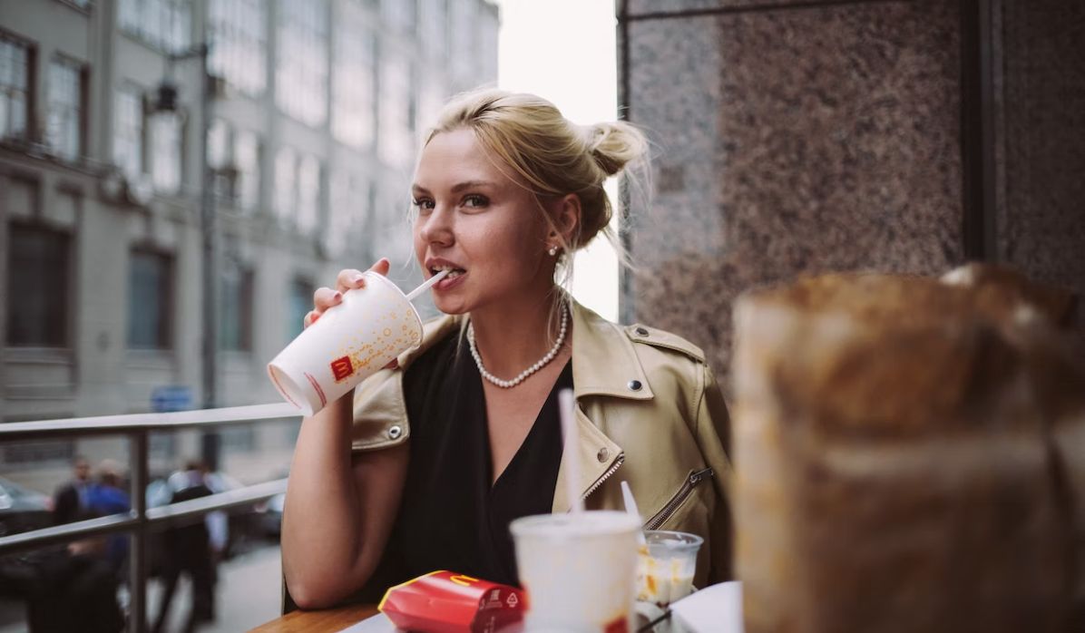 woman with isfp 9w8 personality drinking coffee