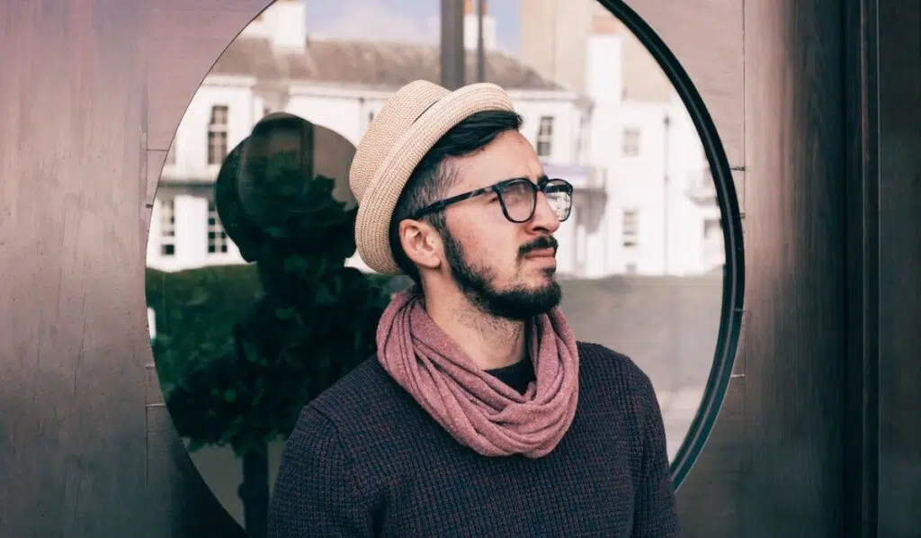 cancer sun leo moon man wearing a hat