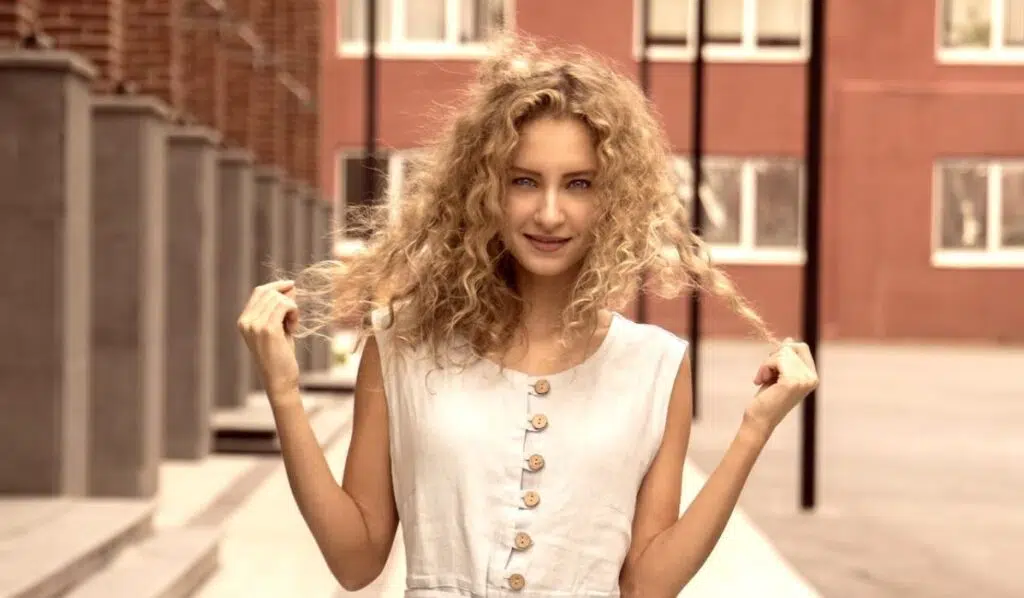gemini sun cancer moon woman with curly hair