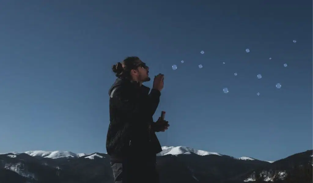 gemini sun pisces moon man making bubbles