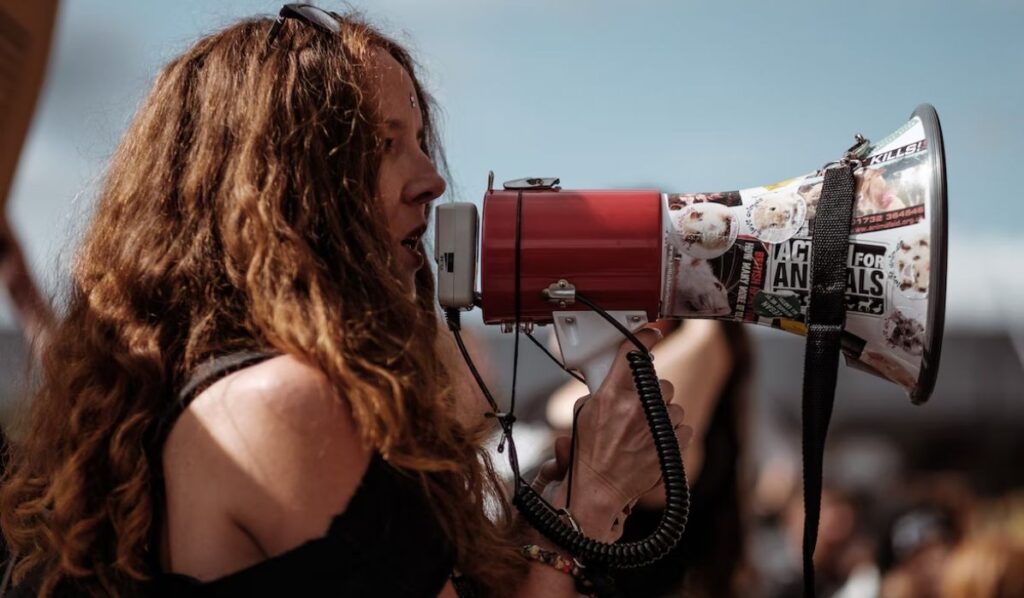 estp woman talking on a megaphone