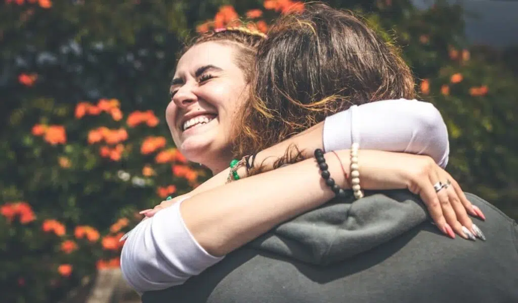 juno conjunct venus couple laughing and hugging