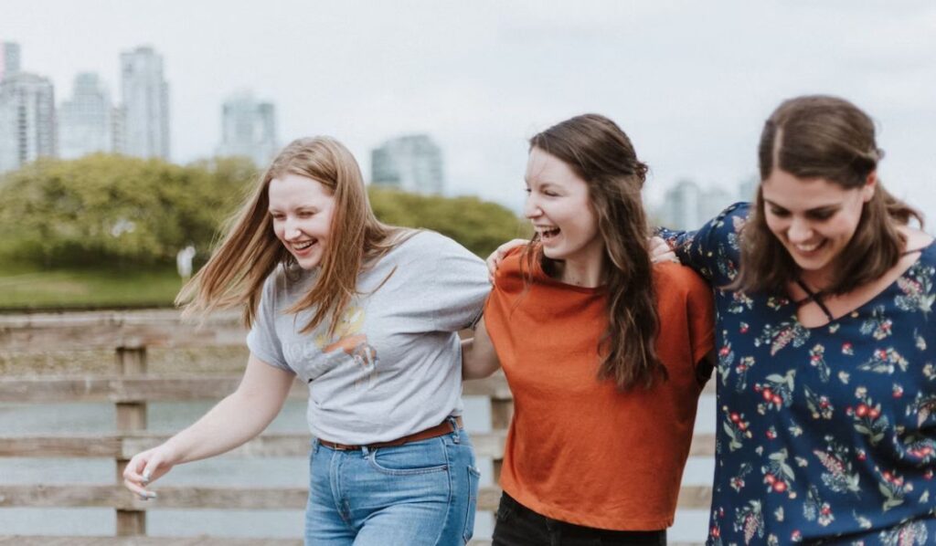 three women laughing