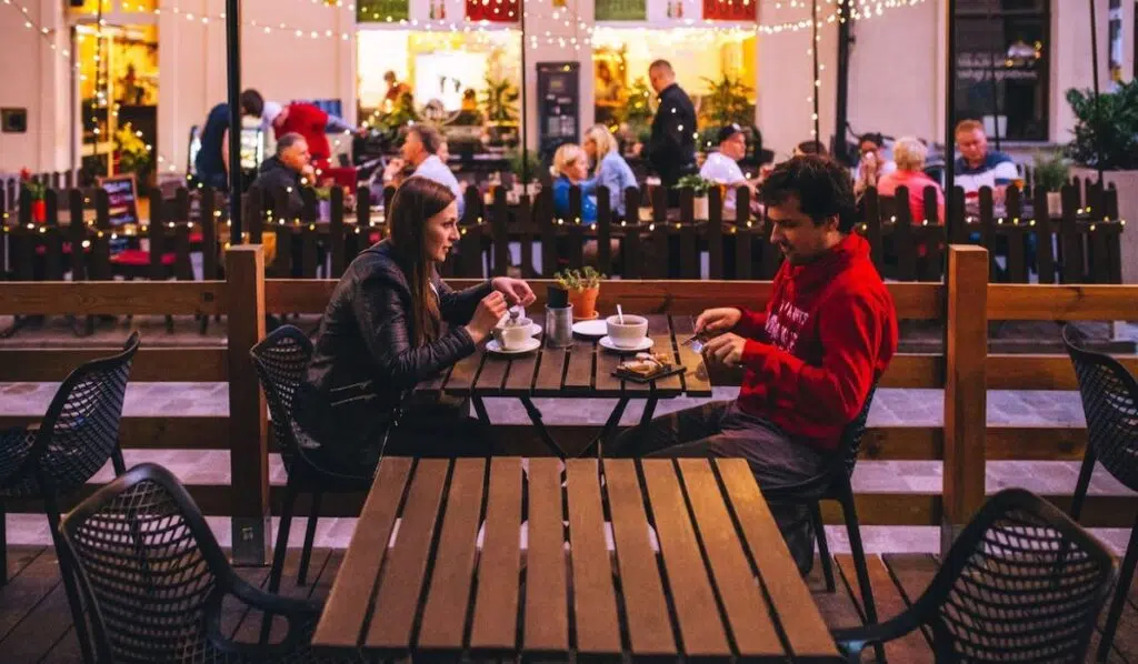 venus sextile pluto couple having coffee