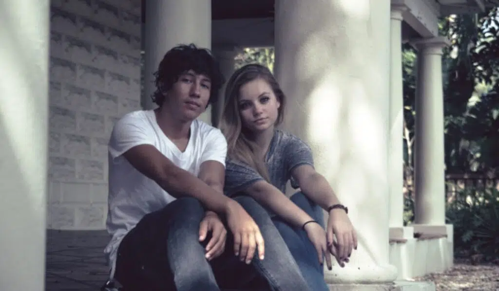 jupiter trine north node couple sitting on a sidewalk