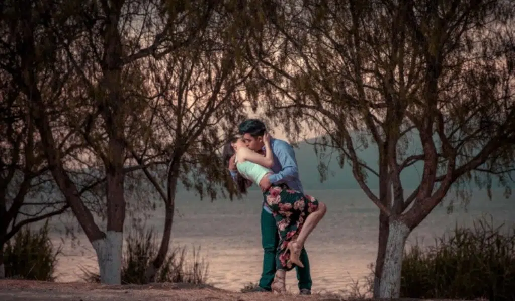 lilith conjunct north node couple kissing in the forest
