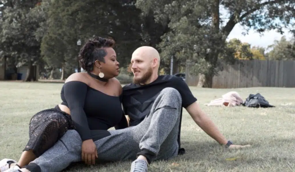 north node trine chiron couple sitting on grass