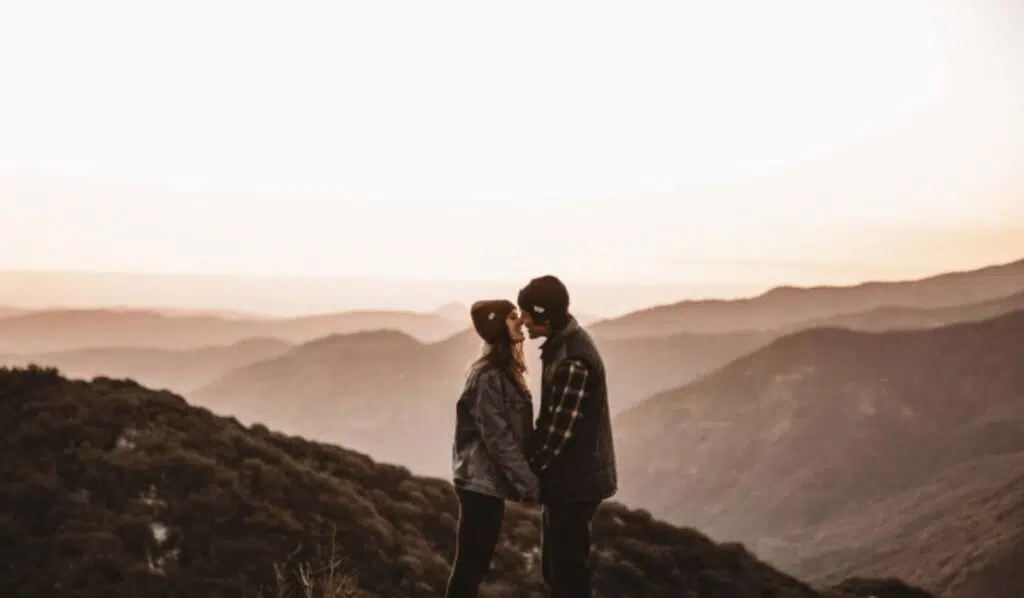 saturn trine north node couple kissing in the mountains