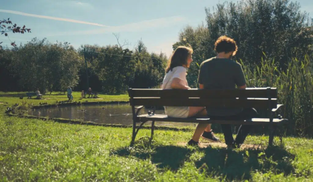uranus sextile north node couple sitting on a bench