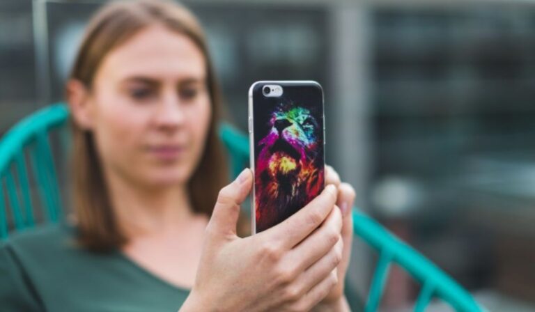 woman looking at her phone on instagram