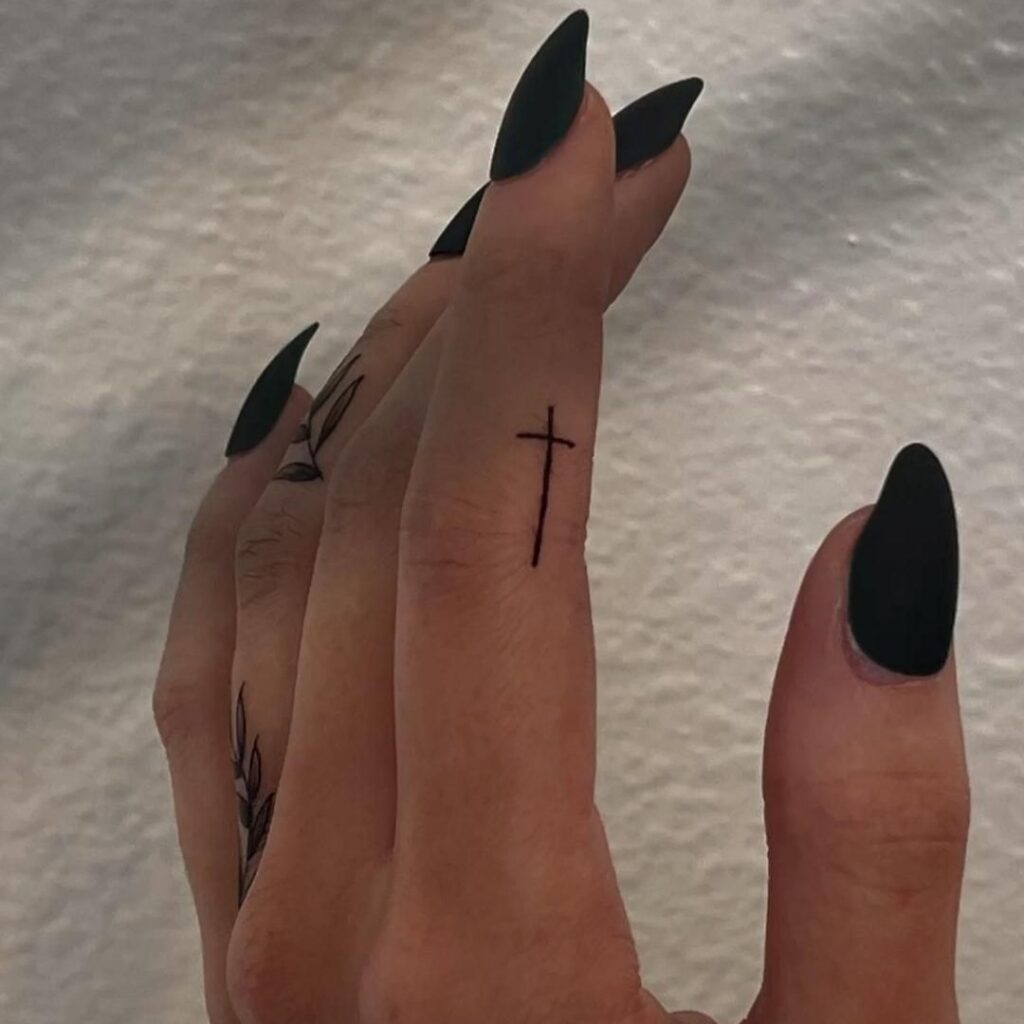 minimalist-finger-cross-tattoo