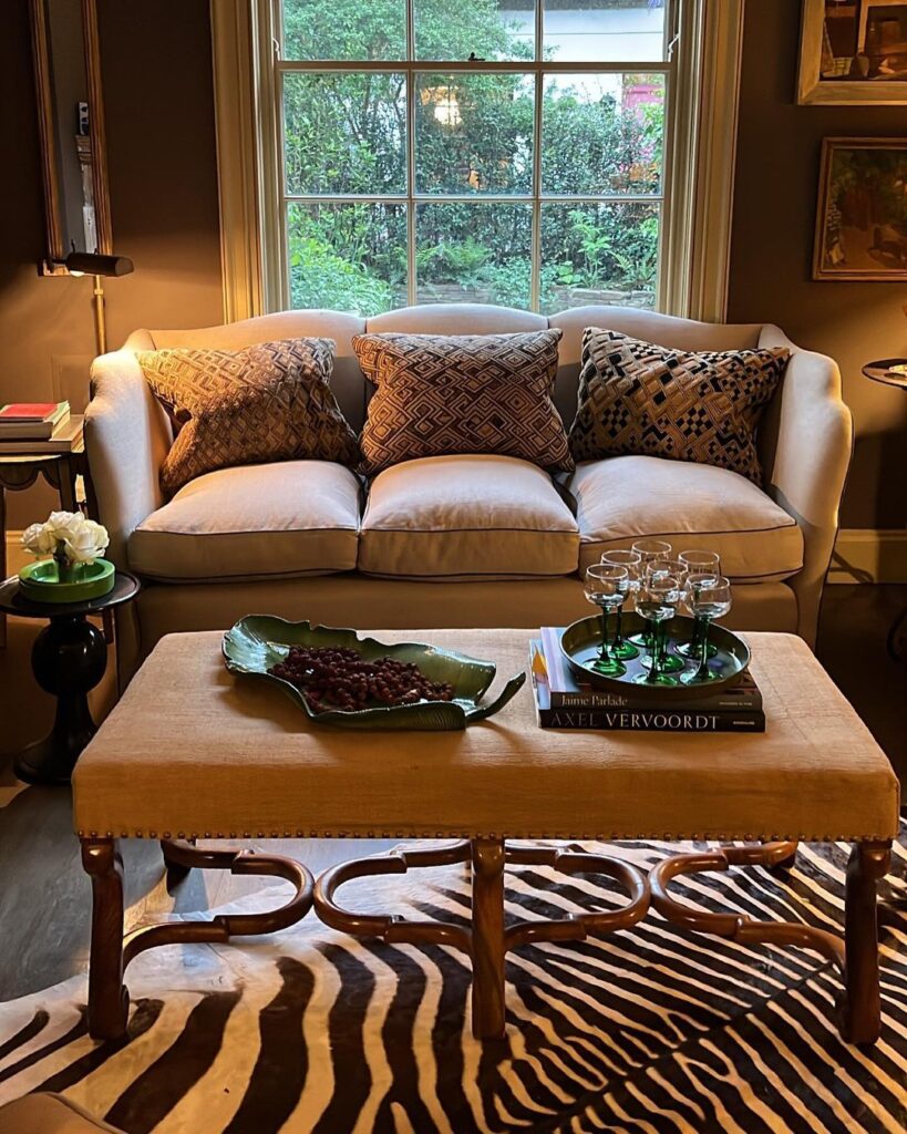 moody-maximalist-living-room-zebra-rug-vintage-charm