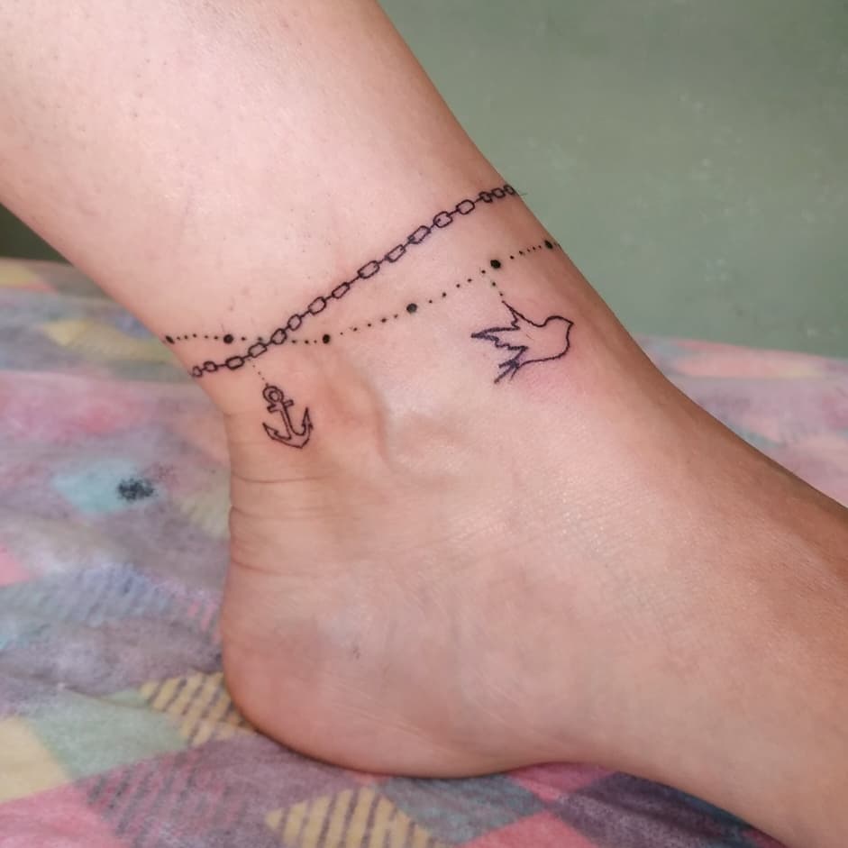 anchor-bird-chain-ankle-tattoo