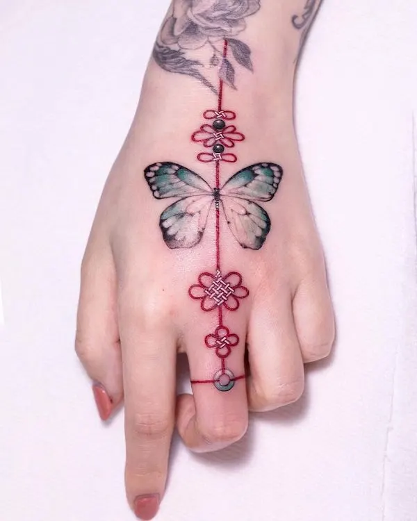 butterfly-and-knot-hand-tattoo