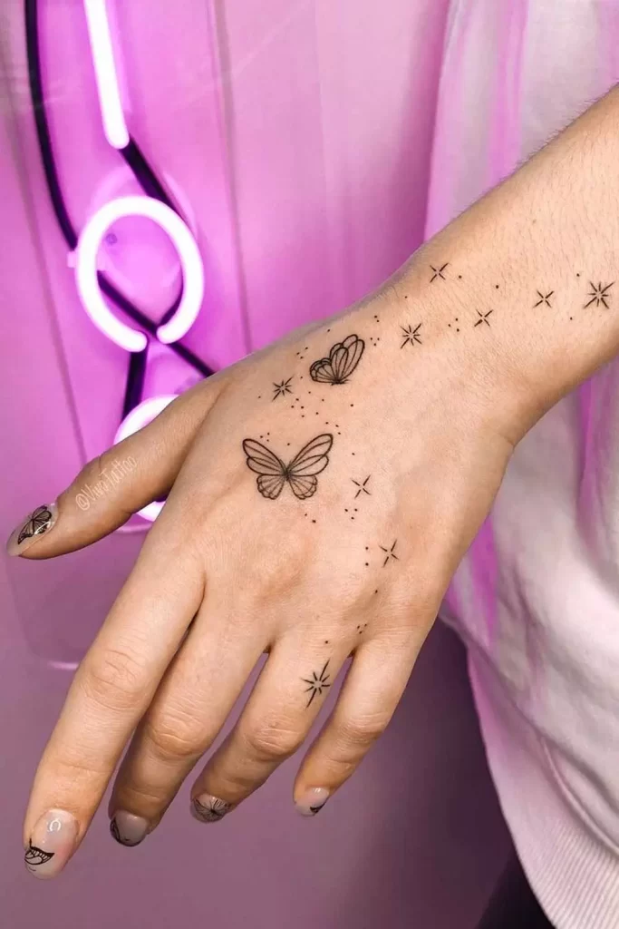 butterfly-and-stars-hand-tattoo