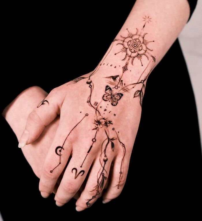 celestial-botanical-hand-tattoo-with-butterflies