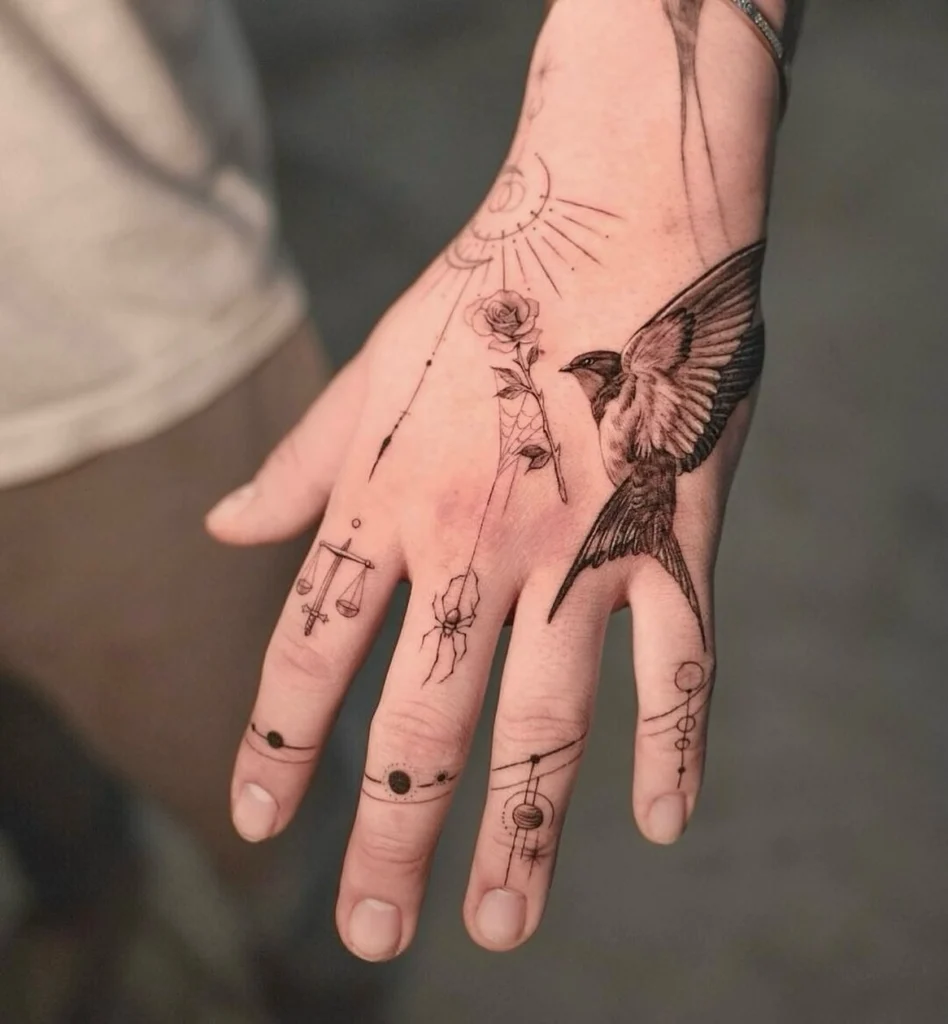 celestial-sparrow-hand-tattoo