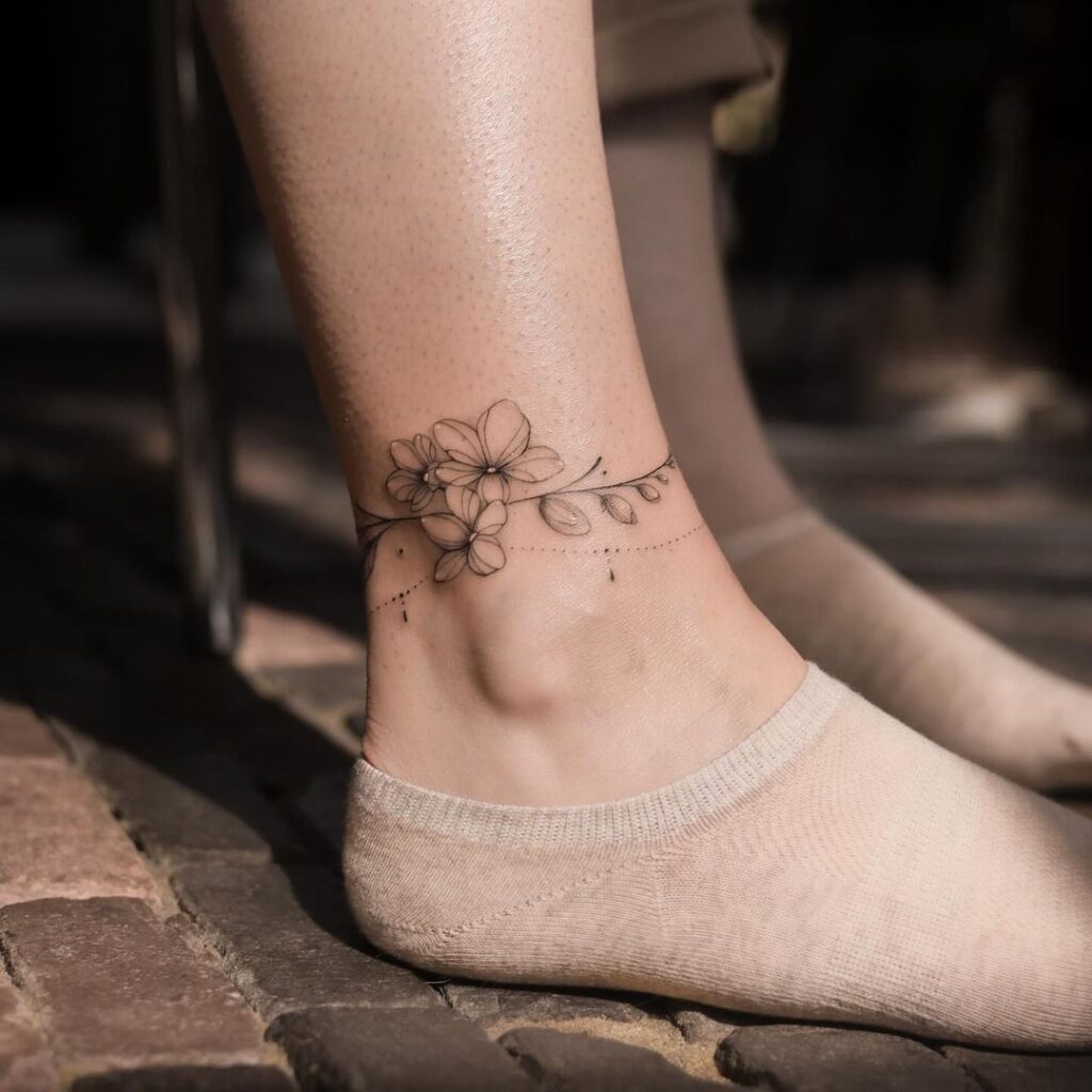 delicate-floral-anklet-tattoo-design