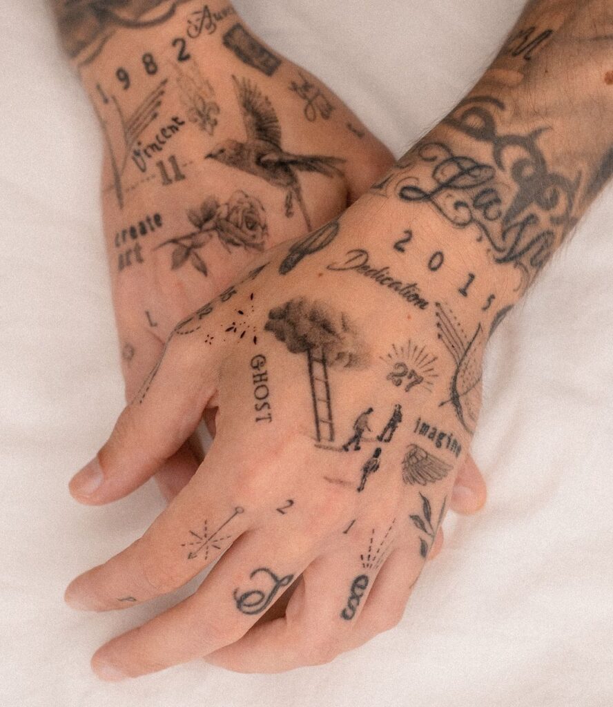 eclectic-symbolic-hand-tattoo