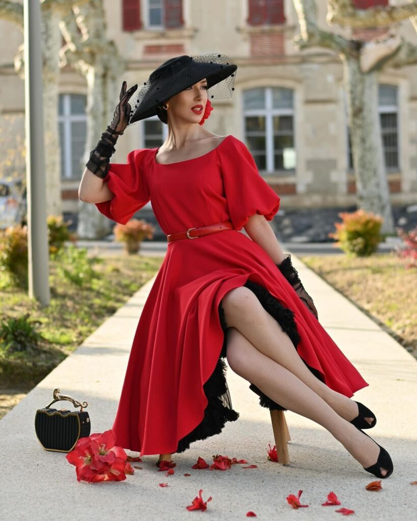 elegant-red-dress-with-black-hat-and-vintage-accessories