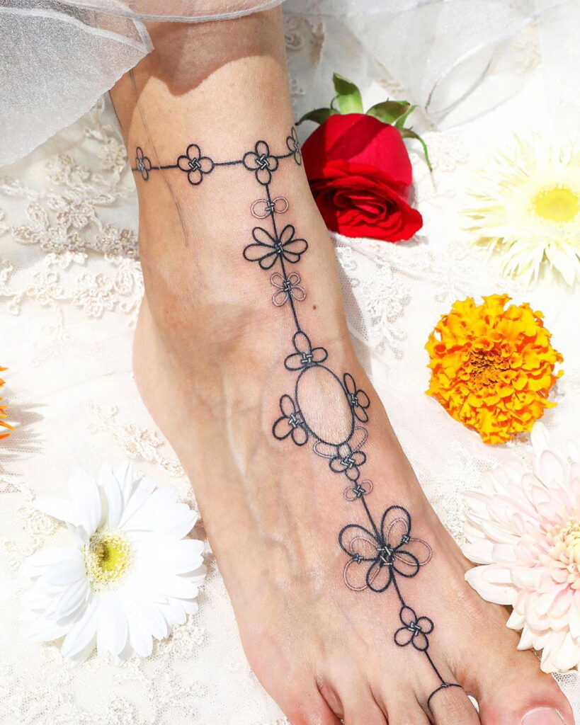 floral-chain-ankle-foot-tattoo