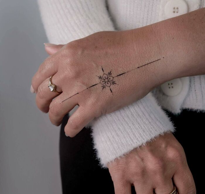 floral-linework-hand-tattoo-minimalist-design