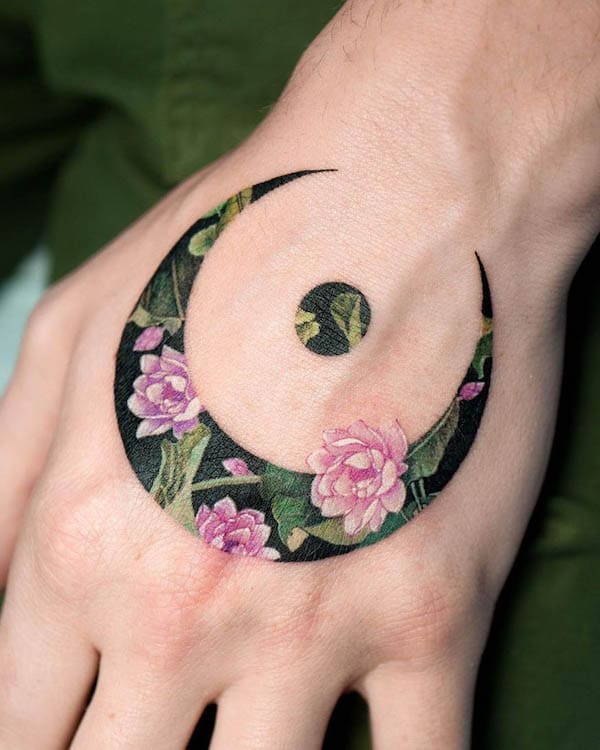 floral-moon-hand-tattoo