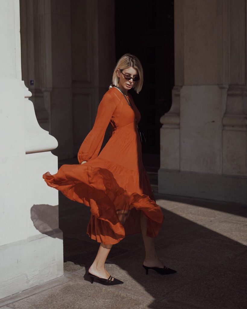 flowing-rust-orange-dress-with-modern-accessories