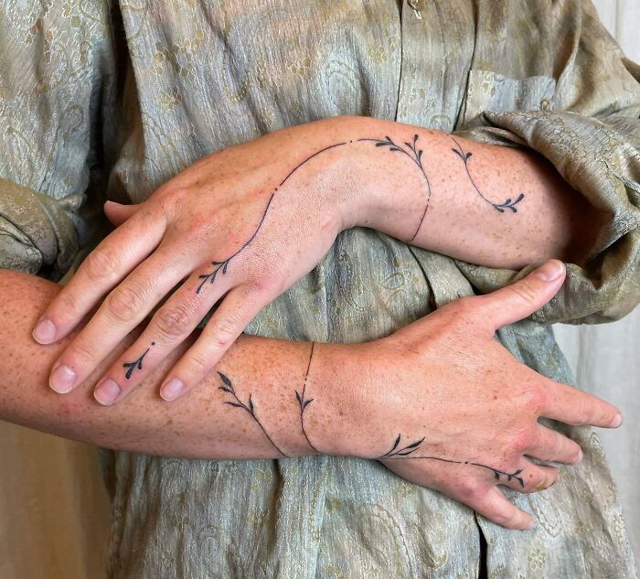 flowing-vine-hand-and-arm-tattoo