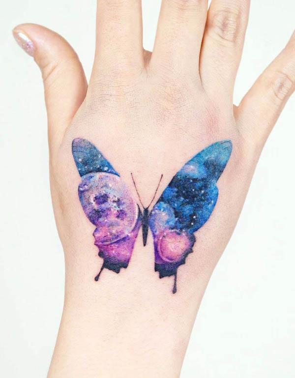 galaxy-butterfly-hand-tattoo