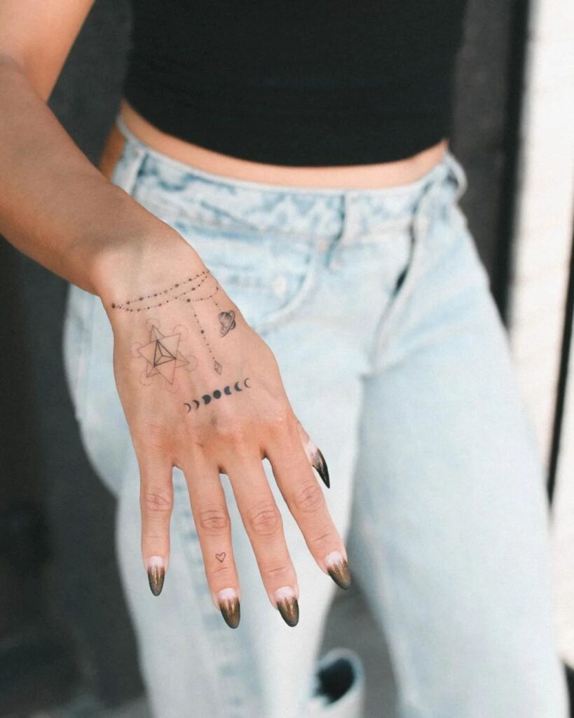 geometric-celestial-hand-tattoo