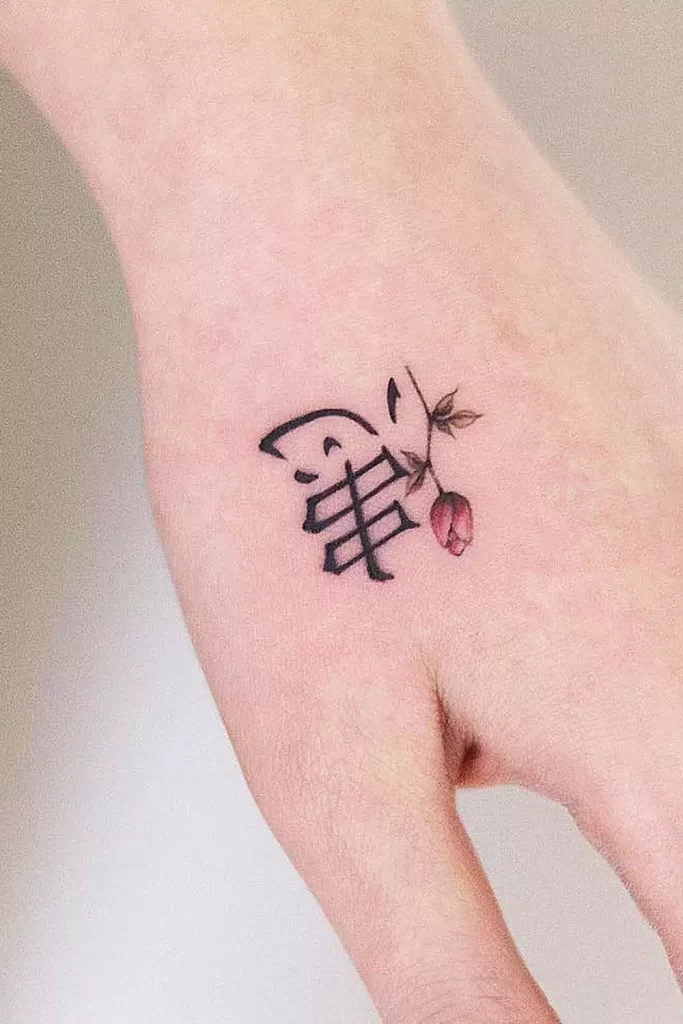 minimalist-butterfly-hand-tattoo