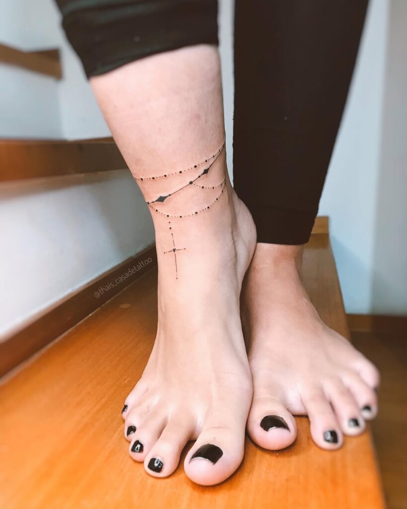 minimalist-cross-ankle-tattoo