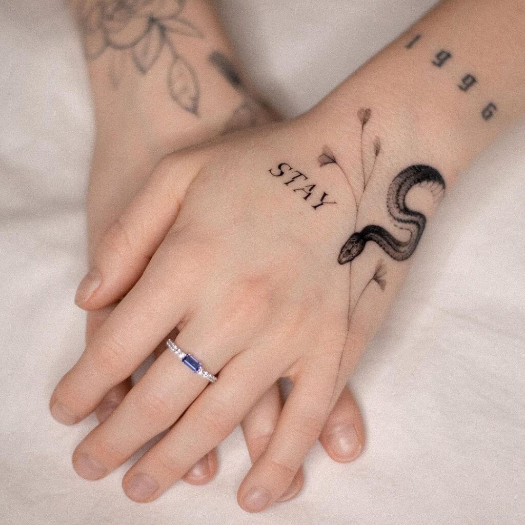 stay-and-snake-hand-tattoo