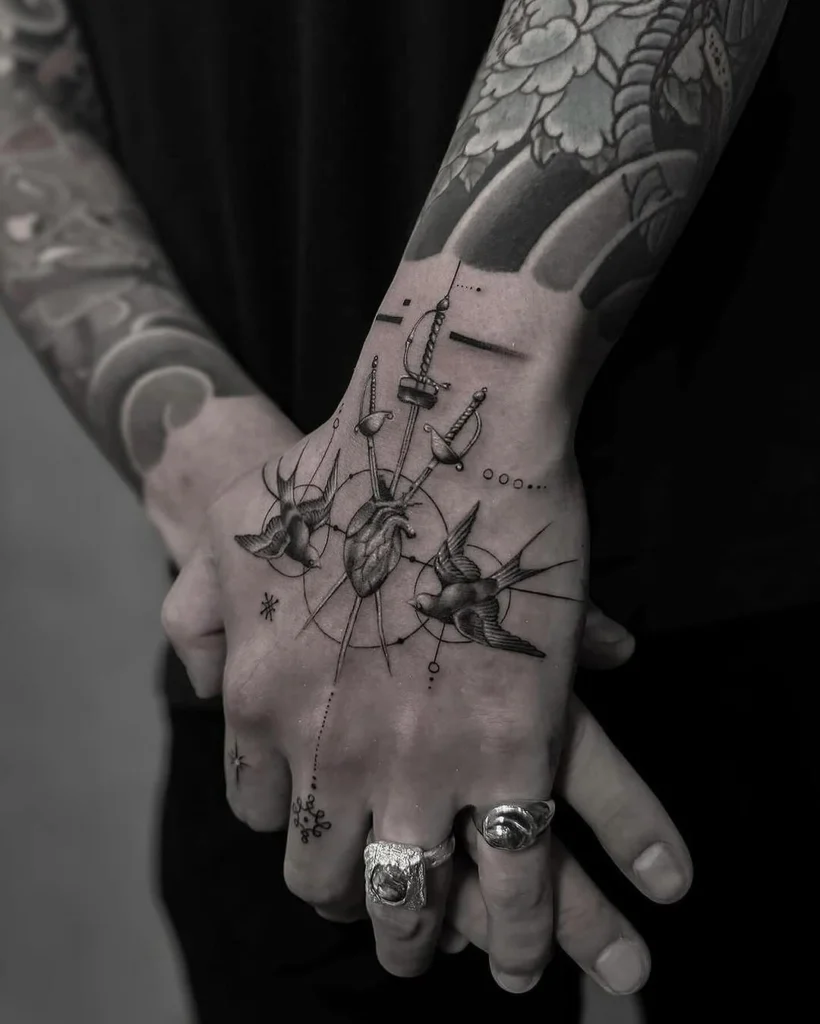 swords-hearts-doves-hand-tattoo