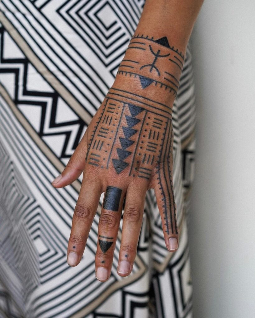 tribal-geometric-hand-tattoo