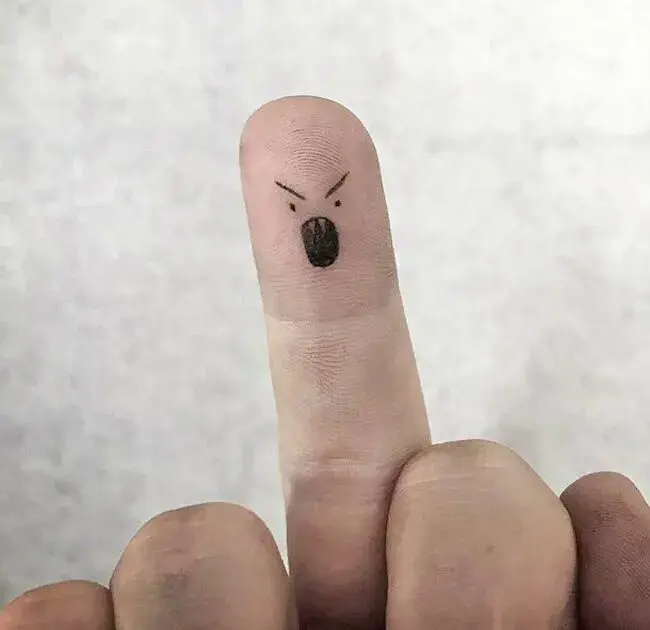 angry-face-finger-tattoo