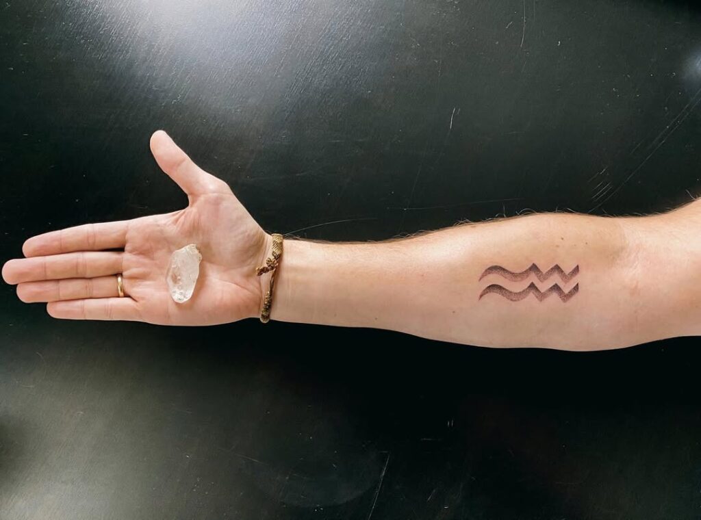 aquarius-zodiac-wave-tattoo-forearm