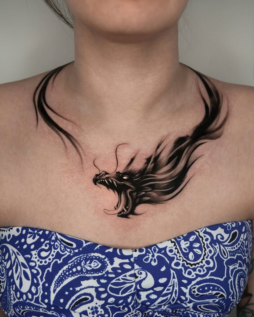 bold-dragon-collarbone-tattoo