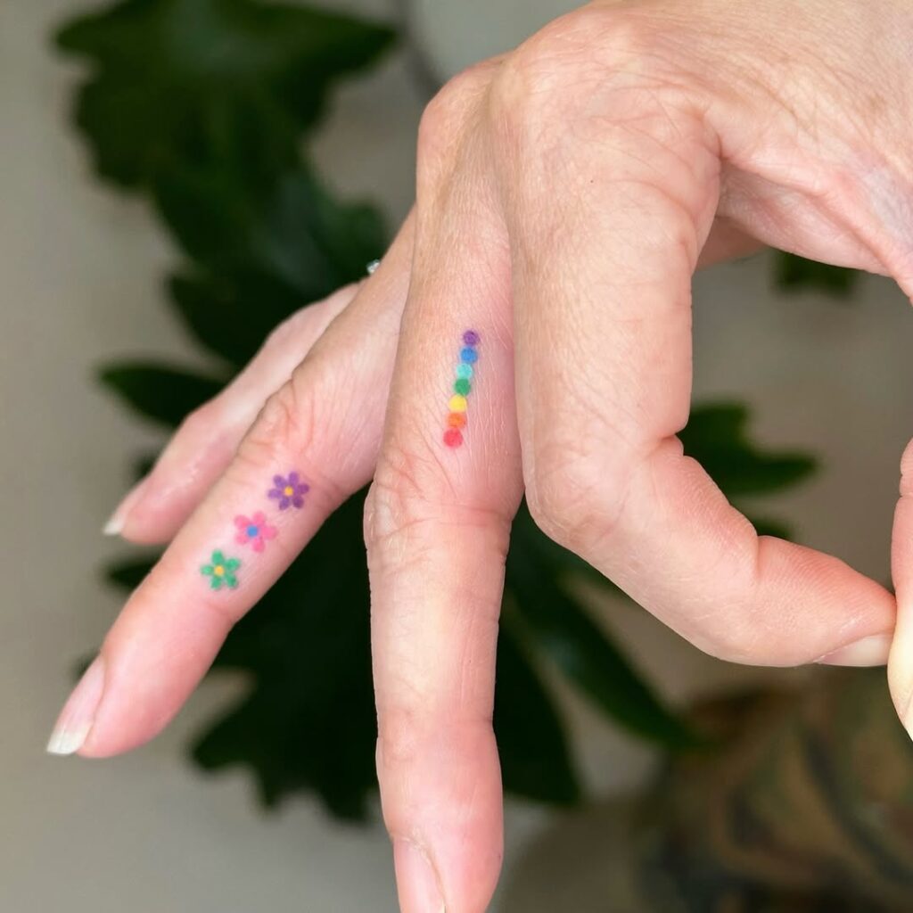 colorful-dot-and-flower-finger-tattoo-design