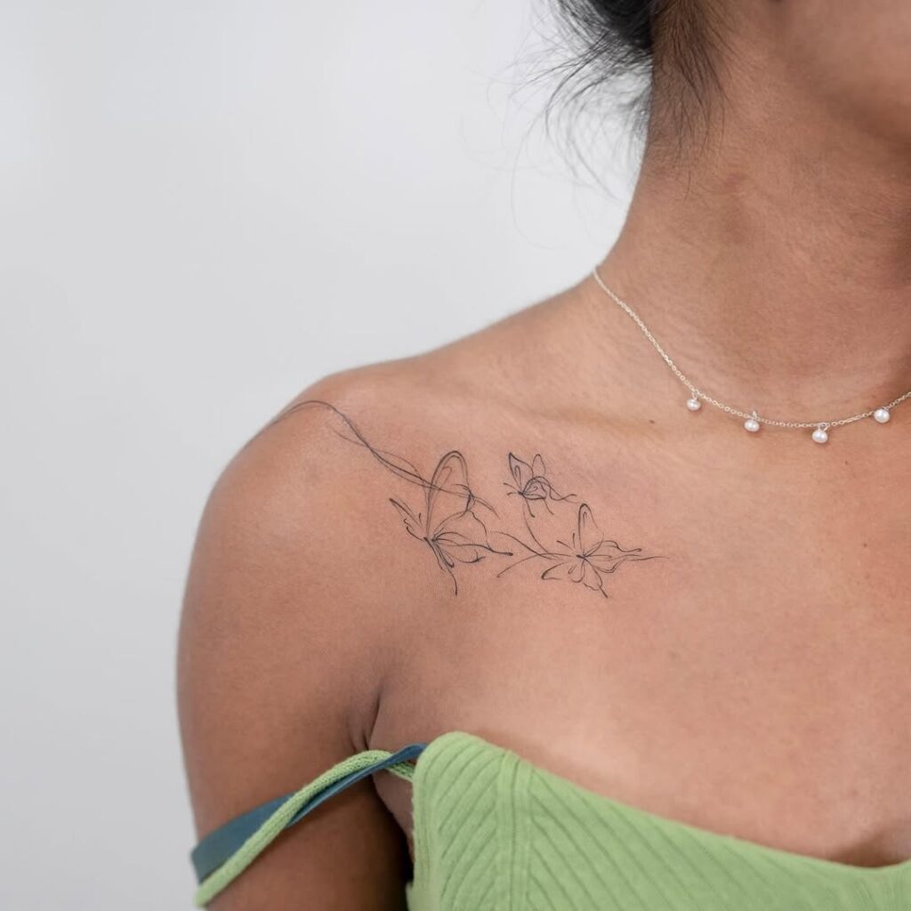 delicate-butterfly-collarbone-tattoo