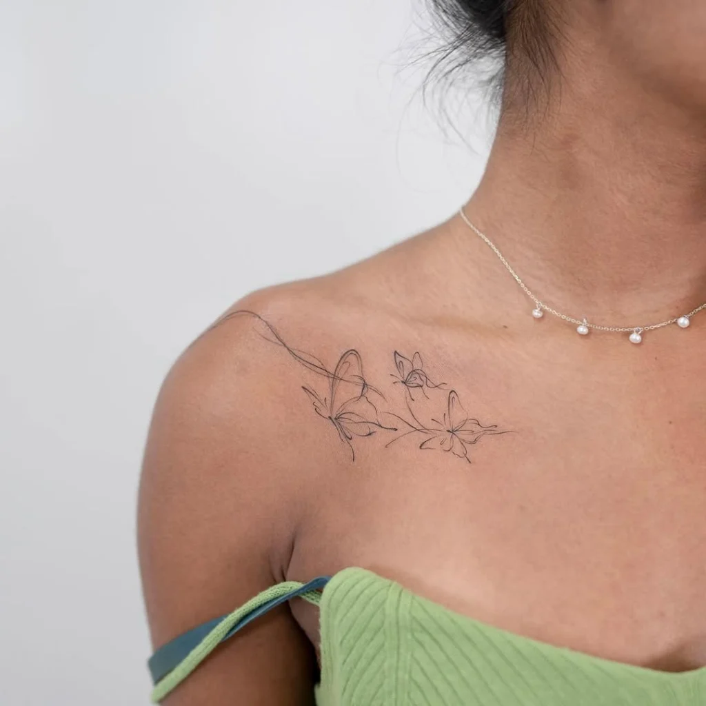 delicate-butterfly-collarbone-tattoo