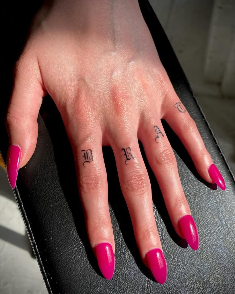 gothic-script-finger-tattoo-design