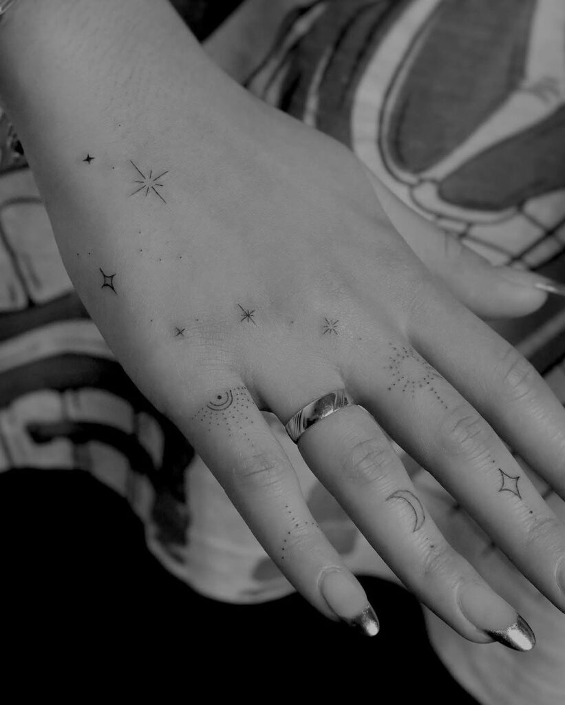 minimalist-celestial-hand-tattoo-design