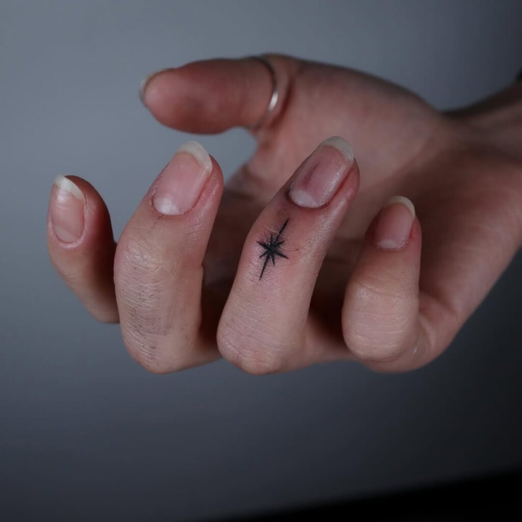 minimalist-starburst-finger-tattoo-design