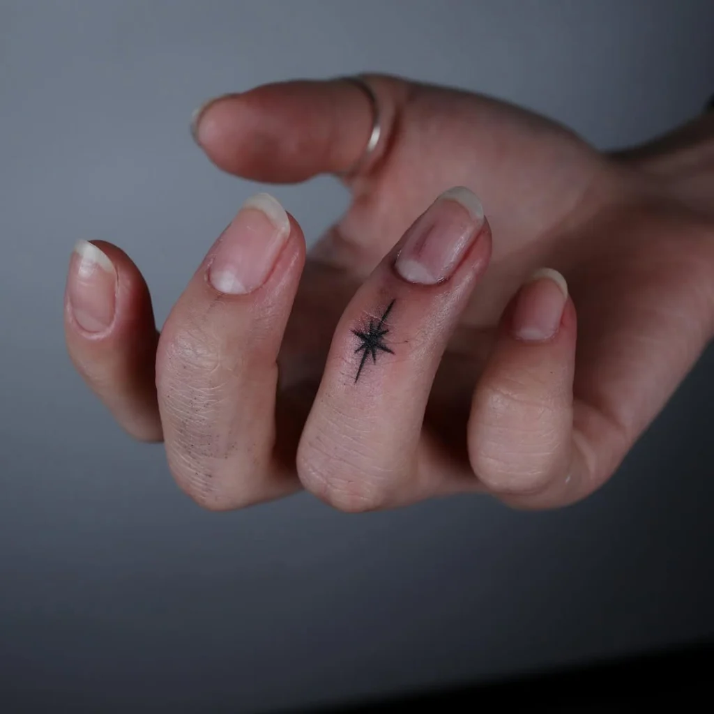 minimalist-starburst-finger-tattoo-design