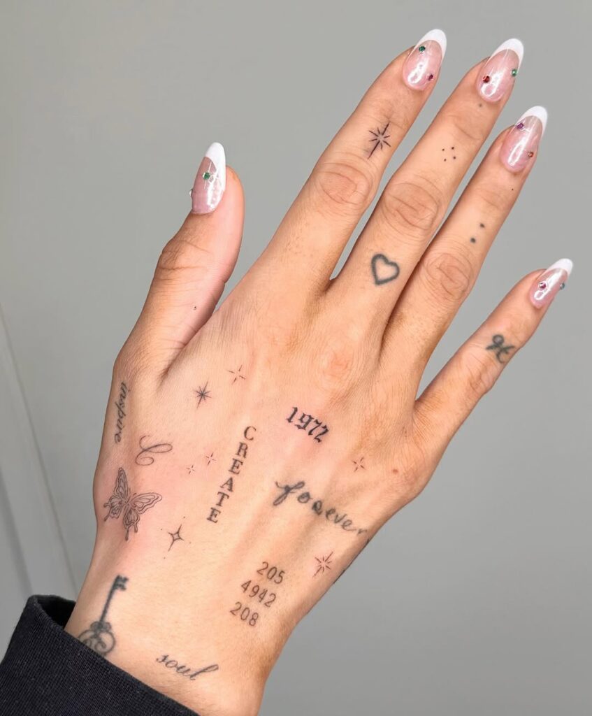 minimalist-text-and-symbol-hand-tattoo-design