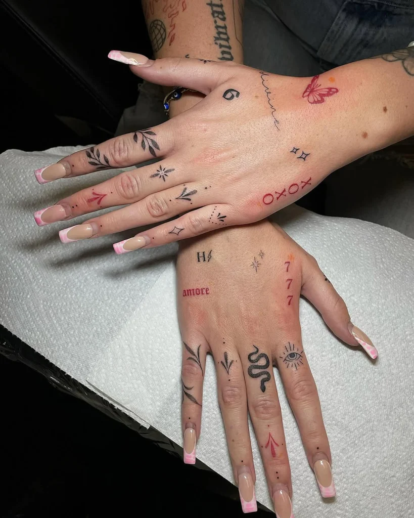 mixed-symbol-and-script-hand-tattoo-design