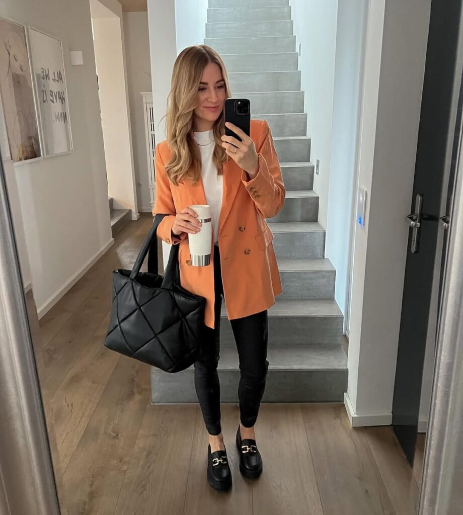 orange-blazer-black-pants-loafers-work-look